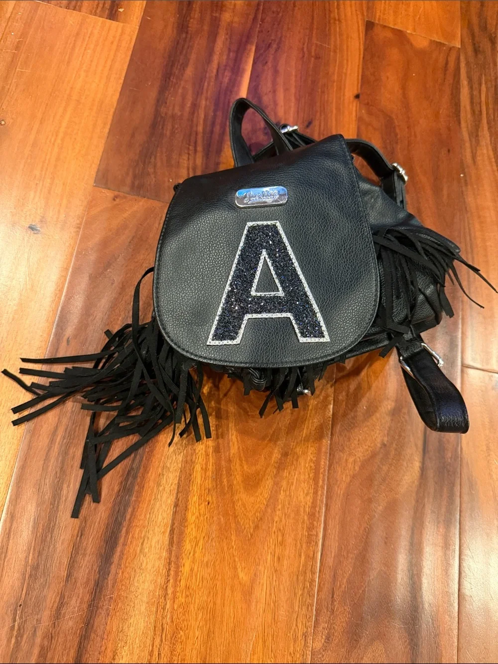 Black Fringe Faux Leather Mini Backpack with letter A from Justice